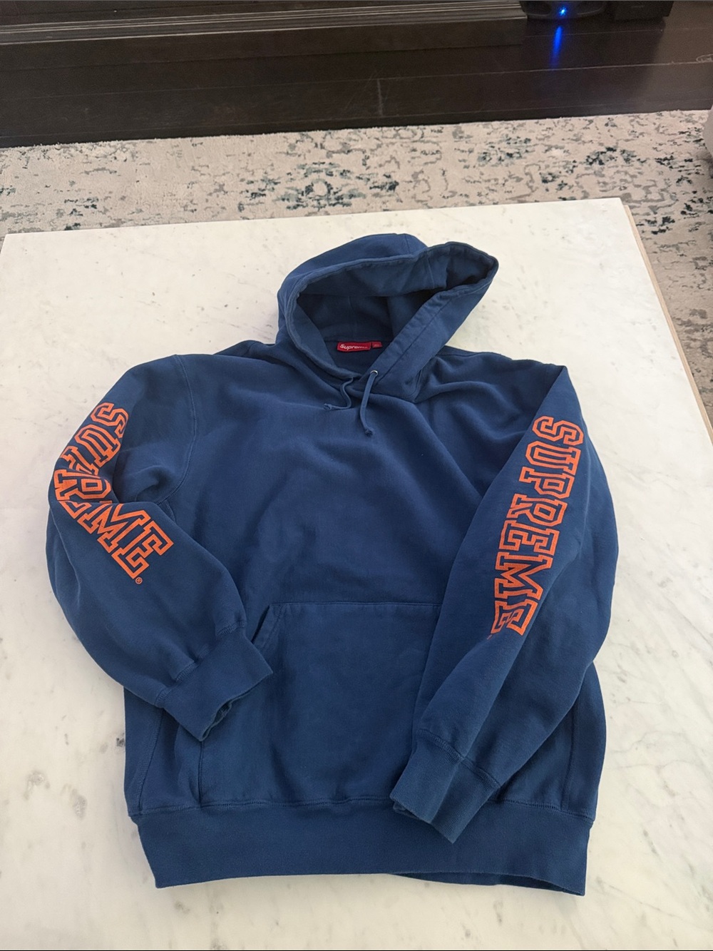 Supreme Navy Hoodie with Orange Sleeve Logos